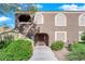 Exterior view of a light brown building with landscaping and walkway at 7950 W Flamingo Rd # 1041, Las Vegas, NV 89147