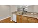 Kitchen features granite countertops, a double sink, and wood cabinets at 7950 W Flamingo Rd # 1041, Las Vegas, NV 89147