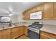Updated kitchen with stainless steel appliances and wood cabinets at 7950 W Flamingo Rd # 1041, Las Vegas, NV 89147