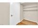 Laundry room with wood flooring and shelving at 7950 W Flamingo Rd # 1041, Las Vegas, NV 89147