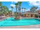 Community pool with palm trees and lounge chairs at 7950 W Flamingo Rd # 1041, Las Vegas, NV 89147