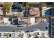 Bird's-eye view of a house showcasing solar panels, modern landscaping, and a well-maintained street at 8736 Summoners Ct, Las Vegas, NV 89139