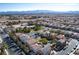 An aerial view of a home in a suburban neighborhood with lush landscaping, offering a peaceful residential environment at 8736 Summoners Ct, Las Vegas, NV 89139