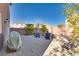 Backyard featuring a gravel area with seating and a fire pit at 8736 Summoners Ct, Las Vegas, NV 89139