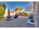 Relax in this backyard featuring gravel, comfortable seating, and a fire pit for cozy outdoor evenings at 8736 Summoners Ct, Las Vegas, NV 89139