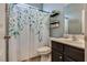Bathroom featuring decorative shower curtain, toilet, vanity, and decor at 8736 Summoners Ct, Las Vegas, NV 89139
