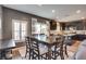 Open dining room featuring hardwood floors and stylish dark wood cabinetry at 8736 Summoners Ct, Las Vegas, NV 89139