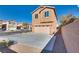 Inviting two-story home featuring a spacious driveway and attached two-car garage at 8736 Summoners Ct, Las Vegas, NV 89139