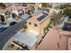 Two-story house highlighting a two-car garage, desert landscaping, solar panels, and a friendly neighborhood at 8736 Summoners Ct, Las Vegas, NV 89139