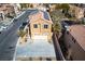 Two-story home featuring a two-car garage, solar panels, and a well-manicured front yard at 8736 Summoners Ct, Las Vegas, NV 89139