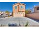 Inviting two-story home featuring a spacious driveway and attached two-car garage at 8736 Summoners Ct, Las Vegas, NV 89139
