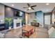 Comfortable living room featuring a fireplace, tv, and hardwood floors throughout at 8736 Summoners Ct, Las Vegas, NV 89139
