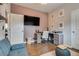 Living room with sofas, desk and mounted TV at 8736 Summoners Ct, Las Vegas, NV 89139