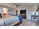 Spacious main bedroom with large TV and ample closet space at 8736 Summoners Ct, Las Vegas, NV 89139