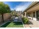 Relaxing backyard oasis with a pergola and artificial turf at 9303 Oxbow Lake Ave, Las Vegas, NV 89149