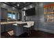 Elegant bar area in game room, featuring custom cabinetry and counter seating at 10000 Cresent Mesa Ln, Las Vegas, NV 89145
