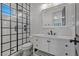 Modern bathroom featuring a glass-enclosed shower, subway tile, and black fixtures at 10000 Cresent Mesa Ln, Las Vegas, NV 89145