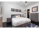 This is a bedroom that features hardwood floors and motivational wall art, creating a stylish and inspiring space at 10000 Cresent Mesa Ln, Las Vegas, NV 89145