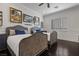 Bright bedroom featuring two beds, framed artwork, and plantation shutters at 10000 Cresent Mesa Ln, Las Vegas, NV 89145