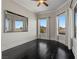 Bedroom with crown molding, multiple windows, and dark hardwood floors at 10000 Cresent Mesa Ln, Las Vegas, NV 89145