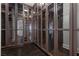 Spacious closet with custom shelving and glass-front cabinets for organized storage at 10000 Cresent Mesa Ln, Las Vegas, NV 89145