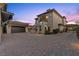 Elegant two-story home with a separate garage, second story balcony and driveway at 10000 Cresent Mesa Ln, Las Vegas, NV 89145