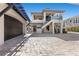 Attractive home featuring two garages and a basketball hoop at 10000 Cresent Mesa Ln, Las Vegas, NV 89145