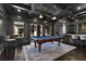 Elegant game room with a pool table, coffered ceiling, and bar area at 10000 Cresent Mesa Ln, Las Vegas, NV 89145
