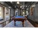 Well-appointed game room features a pool table, custom bar, and outdoor access at 10000 Cresent Mesa Ln, Las Vegas, NV 89145