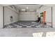 Spacious three car garage featuring checkerboard flooring and ample storage at 10000 Cresent Mesa Ln, Las Vegas, NV 89145