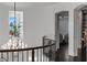 Hallway with archway, chandelier, and transom window at 10000 Cresent Mesa Ln, Las Vegas, NV 89145