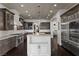 Well-appointed kitchen with custom cabinets, large island, and stainless steel appliances at 10000 Cresent Mesa Ln, Las Vegas, NV 89145