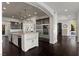 Gourmet kitchen featuring an island, stainless steel refrigerator and decorative wood ceiling at 10000 Cresent Mesa Ln, Las Vegas, NV 89145