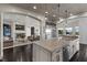 Open-concept kitchen with center island flowing into living space at 10000 Cresent Mesa Ln, Las Vegas, NV 89145