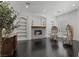 Cozy living room with a decorative tiled fireplace and stylish seating, perfect for relaxation at 10000 Cresent Mesa Ln, Las Vegas, NV 89145