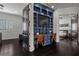 Cozy home office with custom built-in desk and shelving, located between two rooms at 10000 Cresent Mesa Ln, Las Vegas, NV 89145
