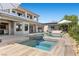 Stunning backyard showcasing a pool, spa, and beautifully landscaped surroundings at 10000 Cresent Mesa Ln, Las Vegas, NV 89145