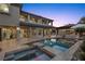 Gorgeous backyard with a sparkling pool, spa, and covered patio, perfect for outdoor entertaining at 10000 Cresent Mesa Ln, Las Vegas, NV 89145