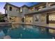 Stunning backyard with a swimming pool and luxurious residence at 10000 Cresent Mesa Ln, Las Vegas, NV 89145