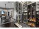 Custom glass enclosed wine cellar with bottle racks and display shelves at 10000 Cresent Mesa Ln, Las Vegas, NV 89145