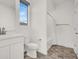 Bright bathroom featuring a modern toilet, vanity, and shower-tub combo at 10116 Rebel Coast St, Las Vegas, NV 89141