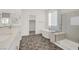 Modern bathroom featuring double vanity, soaking tub and separate shower at 10116 Rebel Coast St, Las Vegas, NV 89141