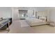 Well-lit bedroom with a large bed, plush pillows, and windows at 10116 Rebel Coast St, Las Vegas, NV 89141