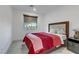 Comfortable bedroom showcasing plush bedding, a stylish headboard, and contemporary furnishings at 10116 Rebel Coast St, Las Vegas, NV 89141