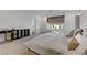 Bright primary bedroom featuring a large bed and a window at 10116 Rebel Coast St, Las Vegas, NV 89141