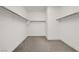 Walk-in closet featuring shelving and neutral carpet at 10116 Rebel Coast St, Las Vegas, NV 89141
