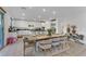 Open dining room area with view of gourmet kitchen and sliding door access to backyard at 10116 Rebel Coast St, Las Vegas, NV 89141