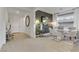 Elegant dining room boasts modern chandelier, textured wallpaper, and stylish furniture at 10116 Rebel Coast St, Las Vegas, NV 89141