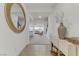 Inviting entryway features a stylish mirror, decorative vases, console table, and tiled floor at 10116 Rebel Coast St, Las Vegas, NV 89141