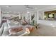 Bright living room with modern decor, plush seating, and open layout to kitchen and dining at 10116 Rebel Coast St, Las Vegas, NV 89141